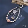 Nuevo colgante de manzana y mariposa con cuentas hecho a mano para teléfono, con un toque de alta gama, charm de cadena doble para bolso, cadena para colgar el teléfono, regalo