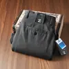 Nueva colección de otoño: Pantalones de hombre de alta gama, texturizados, sin elasticidad, con corte recto holgado y confeccionados con algodón de fibra larga para un ajuste cómodo y casual.