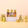 Frasco octogonal de vidro com relevo dourado para óleos essenciais, frasco de sérum roll-on requintado do Oriente Médio, frasco dispensador de perfume de múltiplas especificações, frasco de amostra