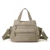 2026 Nova Bolsa Casual Feminina Mini Versátil de Nylon Grande Capacidade Ombro Transversal Bolsa de Mão em Tecido Oxford para Mães