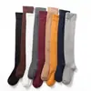 Calcetines blancos de mujer hasta la rodilla para primavera y verano, calcetines largos estilo JK japonés, calcetines altos adelgazantes para muslos, calcetines altos de algodón para estudiantes, industria de calcetines de Zhuji