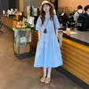 Vestido de Verão 2026 Estilo Francês Suave para Férias na Beira-Mar com Efeito Emagrecedor e Gola Polo Vestido Camisa Azul para Mulheres