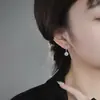 Transmisión en vivo moda transfronteriza imitación moissanita borla princesa pendientes redondos 1 quilate elegantes clips para orejas y pendientes colgantes para mujer al por mayor