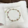 "Flor de Seda Año tras Año" Pulsera Esmaltada Nueva Pintada en Oro Estilo Chino para Mujer, Joyería de Diseño de Lujo Ligero de Nicho de Gama Alta