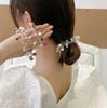 Diadema de cable de teléfono para mujer, temperamento de celebridad de internet, cuerda para la cabeza de perla, color versátil, anillo de teléfono transparente, sin costuras, no daña el cabello, accesorios para el cabello