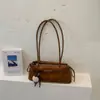 Bolso de axila de nicho estilo francés para mujer, nueva colección otoño/invierno 2026, bolso de hombro casual retro, bolso baguette de alta gama para el trabajo