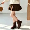 Conjunto de Suéter Jacquard Elegante com Laço e Gola Redonda e Saia de Lã para Meninas 2026 Novo Estiloso Fashionable Tricô Tendência