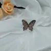 Nuevo de primavera caliente perforado mariposa corsage clip para la cabeza con forma de flor base más joyería flor de zapato material de fábrica venta al por mayor