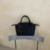 Bolso blanco de estilo minimalista para mujer, bolso de hombro de alta gama para el trabajo, bolso cruzado, bolso tipo dumpling, bolso tote pequeño para el trabajo y artículos varios