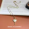 Collar de corazón con borla estilo palacio retro, que irradia una vibra lujosa y moderna, con un diseño único y creativo, convirtiéndolo en un accesorio versátil y exquisito
