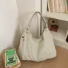 Bolsa de Ombro Underarm de Tecido de Nylon Estilo Coreano Design de Nicho Moda 2025 Tendência Outono e Inverno Suave Bolsa Tote de Ombro Único Feminina