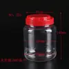 Procesamiento de envases personalizados transparentes de sólido-líquido para cintura latas de alimentos botella de plástico PET de boca ancha con asa tapa botella sellada