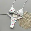 Bikini de lunares blancos de dos piezas para mujer, nuevo estilo verano 2026, cuello halter con lazo, copa triangular, traje de baño sexy reductor