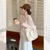 Tricô com Listras Verdes Coreano com Capuz Camisa para Ar Condicionado para Mulheres Design Externo de Verão Camiseta de Manga Longa Proteção Solar