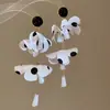 Pendientes de borla de flor de concha blanca transfronterizos europeos y americanos con perlas, pendientes de estilo de corte francés, pendientes ligeros y lujosos con un toque de alta gama