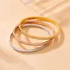 Europa y Estados Unidos moda transfronteriza simple elegante temperamento no se decolora chapado en oro diamante geométrico redondo liso acero inoxidable pulsera
