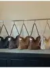 Bolsa de ombro vintage transfronteiriça, bolsa tote de couro macio de grande capacidade para mulheres, novo modelo 2026, bolsa versátil simples e casual para o dia a dia