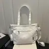Nueva bolsa de tela de color liso transfronteriza 2026 principios de otoño elegante de gran capacidad de alto valor texturizada versátil bolso de hombro cruzado