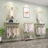 Tienda de ropa estante exhibidor de ropa Dorado estante para ropa decoración de pared colgador montado en la pared tienda de ropa de mujer