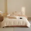 2026 Nuevo Juego de Cama de Cuatro Piezas 60 Hilos 100% Algodón Cepillado Otoño/Invierno Minimalista Dos Tonos Color Sólido Estampado Reactivo