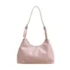 Bolsas de mujer de alto valor nicho 2026 nuevo retro minimalista color liso bolso de axila elegante brillante de un solo hombro bandolera