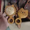 Venta al por mayor desde la fábrica de origen: Peine de masaje de sándalo con pequeñas imperfecciones, peine con cojín de aire, peine de masaje de meridianos del cuero cabelludo, unisex