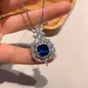 Nuevo conjunto de joyería de pendientes colgantes de lujo incrustados de diamantes azul zafiro retro estilo europeo y americano para mujer