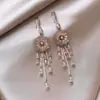 Pendientes de borla con forma de hoja y pluma, redondos, de estilo étnico vintage, de alta gama, de lujo ligero, transfronterizos europeos y americanos