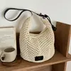 Bolsa de mano tejida de gran capacidad transfronteriza modelo nuevo 2026 bolsa de playa vacacional para el mar bolso de hombro cruzado hueco de moda