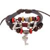 Pulseira de couro original única europeia e americana direta da fábrica, joia de couro de vaca, chaveiro, pequeno pingente, pulseira de miçangas feita à mão