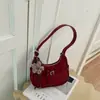 Bolso de Axila Francés para Mujer 2026 Nuevo Bolso de Luna de Grano de Lichi de Gama Alta Versátil Casual de Hombro Único