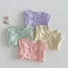 [No hay devoluciones ni cambios] Camiseta Fina Lisa de Color para Niñas 2026 Nuevo Verano Elegante Top de Manga Corta con Cuello de Muñeca para Bebés