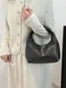 Bolso Tejido de Estilo Francés 2026 de Gama Alta para Mujer, Nuevo Bolso Tipo Dumpling de Moda, Bolso de Textura de Nicho para el Trabajo, Bolso de Mano Versátil