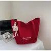 Bolsa de mano tipo tote simple de estilo coreano al por mayor para mujer 2025 Verano Nuevo Gran Capacidad Hombro Único Lona Versátil Bolso de Axila