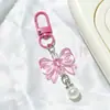 Llavero de lazo colorido con perlas, accesorios hechos a mano para fundas de teléfono, audífonos, bolsos y accesorios de ropa