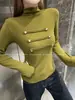 Camiseta de punto negra de manga larga ajustada para mujer, estilo retro americano, moderna, de cuello alto, con botones, colección de otoño 2026