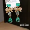 Aretes de Gema Azul Océano Endurecida al Hielo Forma de Gota de Agua Lazo Corazón Estilo Dulce Aretes de Circonita Lujo Ligero Aretes de Alta Gama para Mujer