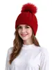 Gorro de punto grueso para adultos de venta caliente transfronterizo, color liso con pompón, cálido y a prueba de viento, gorro de punto para cubrir las orejas al aire libre