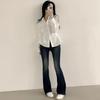 Camisa coreana chic de primavera y otoño de Dongdaemun que ciñe la cintura y adelgaza, con un diseño de estilo bosque de alta gama para mujer