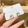 Pendientes combinables puesto de mercado nocturno al por mayor Corea del Sur pendientes explosivos simples diseño de nicho femenino pendientes de moda con temperamento