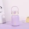 Nueva taza térmica elegante de acero inoxidable con alto valor estético, portátil y conveniente, compacta y simple, con un ambiente juvenil
