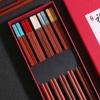 Los nuevos palillos de sándalo rojo imitación jade de alto valor cromático, palillos para una persona, marea nacional, tiemblan una generación de cabello.