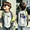 Otoño/Invierno 2026 Nueva Camiseta Térmica de Polar para Niños Cuello Redondo Mangas Raglán Largas Capa Base Elegante Ropa Interior Cálida para Niños Medianos a Grandes