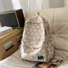 Mochila estilo universitario americano con bordado de letras estrelladas, adecuada para estudiantes, que ofrece un ambiente genial y relajado, versátil para el uso escolar