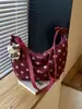 Bolsa de bolinho de design retrô de nicho transfronteiriça 2026 nova moda bolsa transversal de bolinhas bolsa de ombro para o dia a dia sob o braço