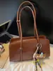 Moda Retro Bolso de Axila para Mujer Otoño 2025 Nuevo Bolso Baguette de Aspecto Elegante Bolso de Mano/Hombro Estilo Occidental de Moda