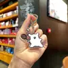 Boneca de cachorro de desenho animado bolsa de boneca pingente de bolsa bolsa mochila de casal pingente de badminton chaveiro atacado