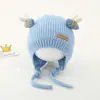 Bonitos y adorables gorros de otoño e invierno para niños, con diseño de poner, material de punto y una serie de dibujos animados, que brindan abrigo y protección para los oídos para bebés y niños pequeños.
