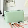 Nuevo Bolso de Maquillaje Seersucker de Venta Caliente Transfronterizo, Neceser de Gran Capacidad, Bolsa de Almacenamiento de Viaje Rayada, Bolso de Mano de Color Sólido