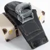 Jeans grossos forrados com fleece masculino de inverno Novo reto solto outono e inverno casual stretch calças compridas masculinas